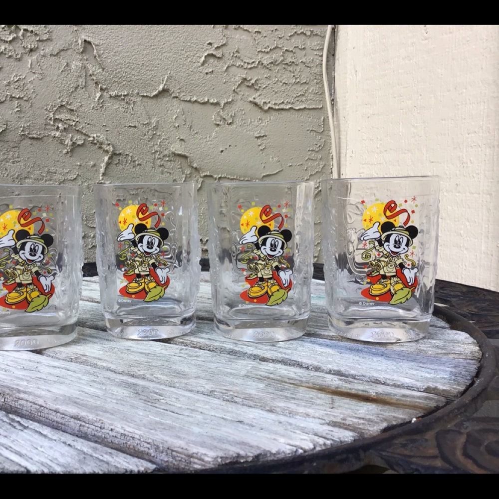 FOUR DISNEY CELEBRATION GLASSES